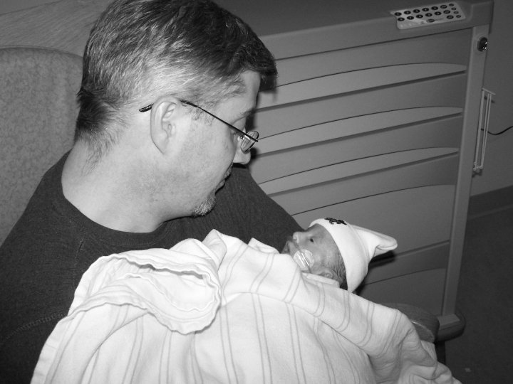 Father Holds Son In NICU